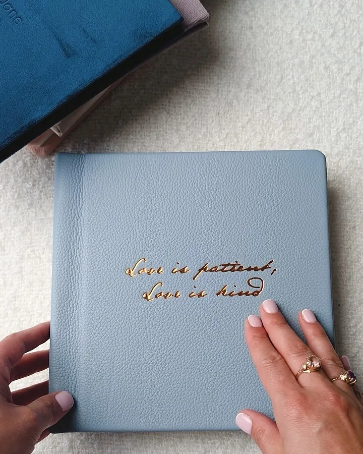 Powder-blue leather, gold foil, one line of script