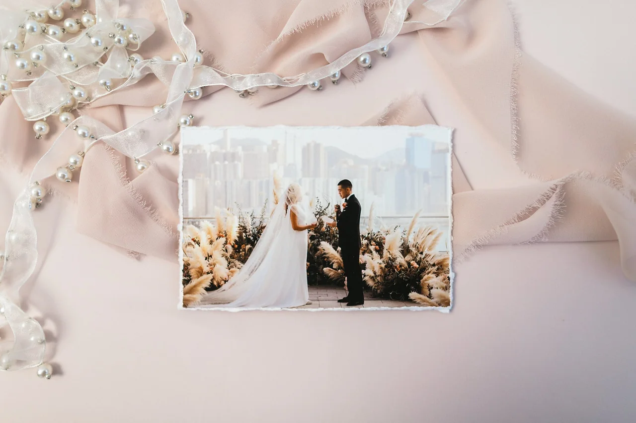 An open clamshell print box filled with photographic prints